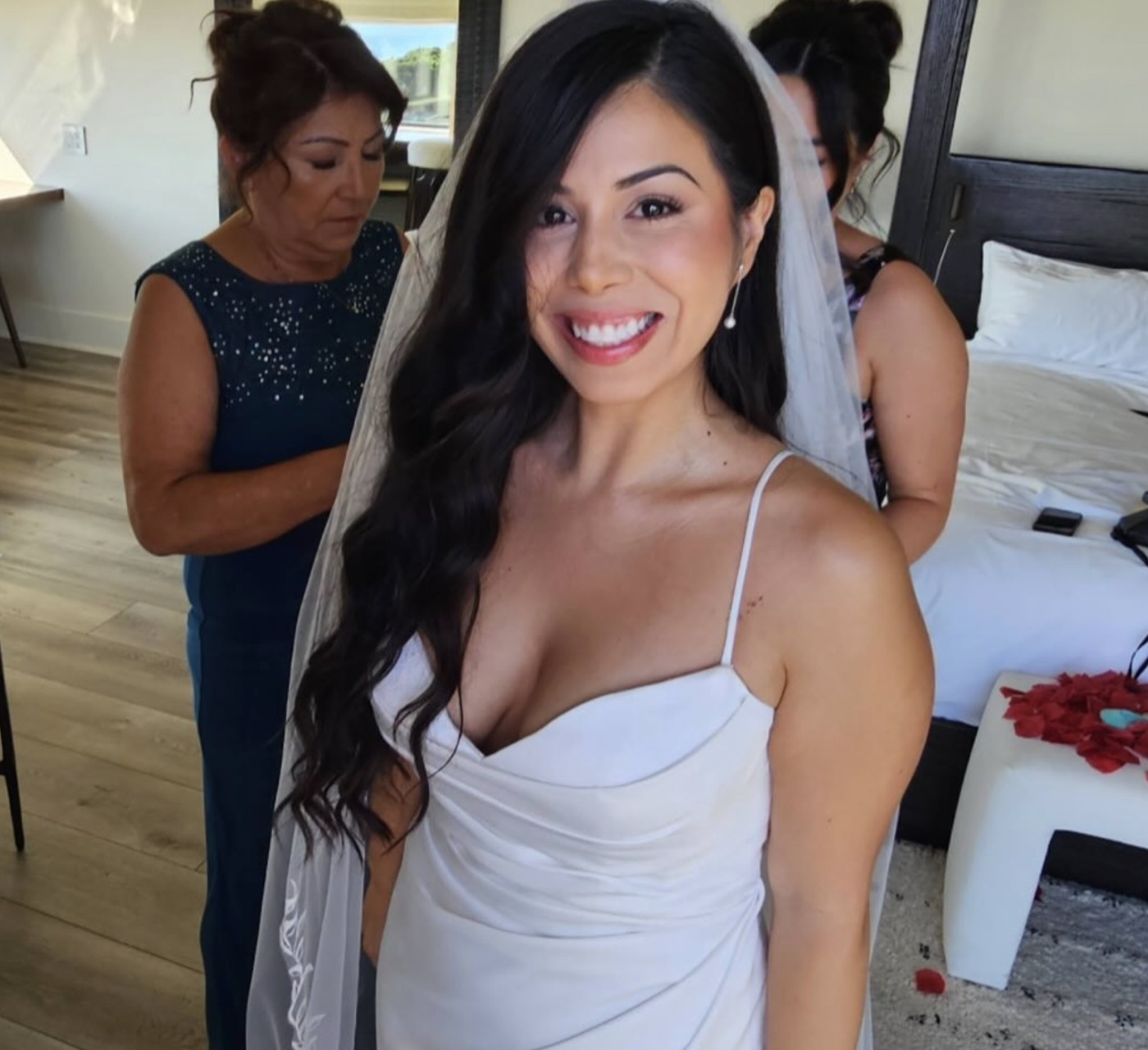 Smiling bride getting ready in her gown and veil, soft glam bridal makeup by Andrea, Bay Area